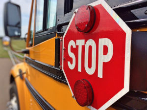 A stop sign on a school bus