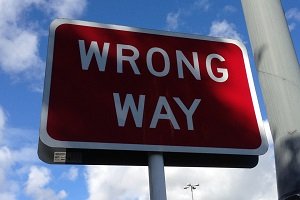 A wrong way sign on the highway
