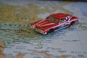 A toy car on the world map