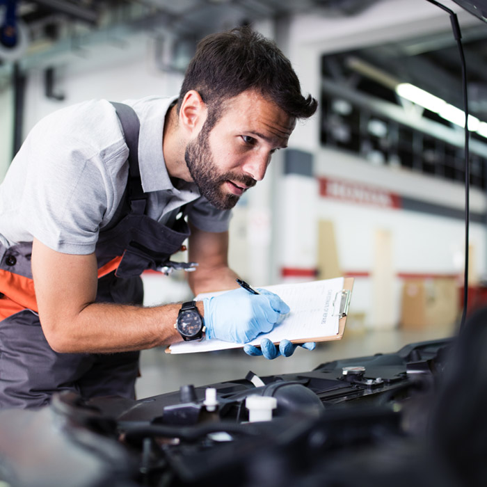 mechanic going through check list