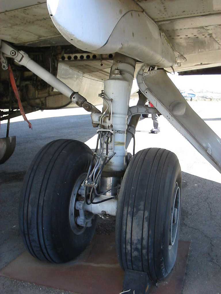 Close-up of airplane landing gear with dual wheels