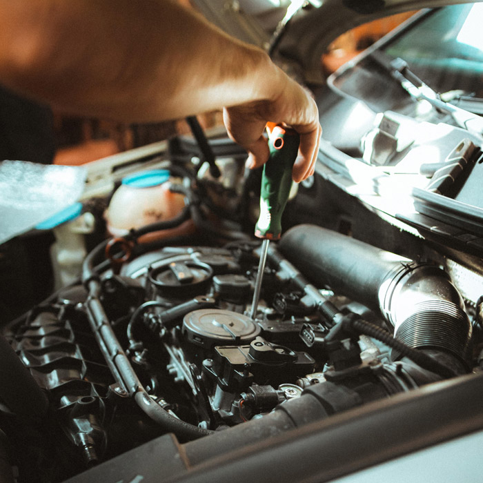 mechanic working on car