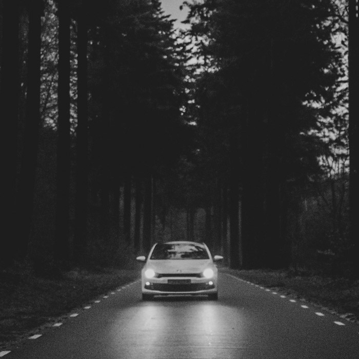 car driving down open road