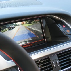 Car dashboard display showing rearview camera view