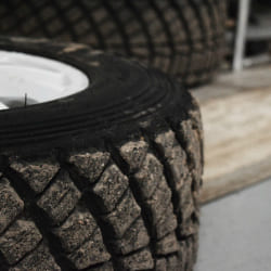 Close-up of a rugged off-road tire with deep tread pattern